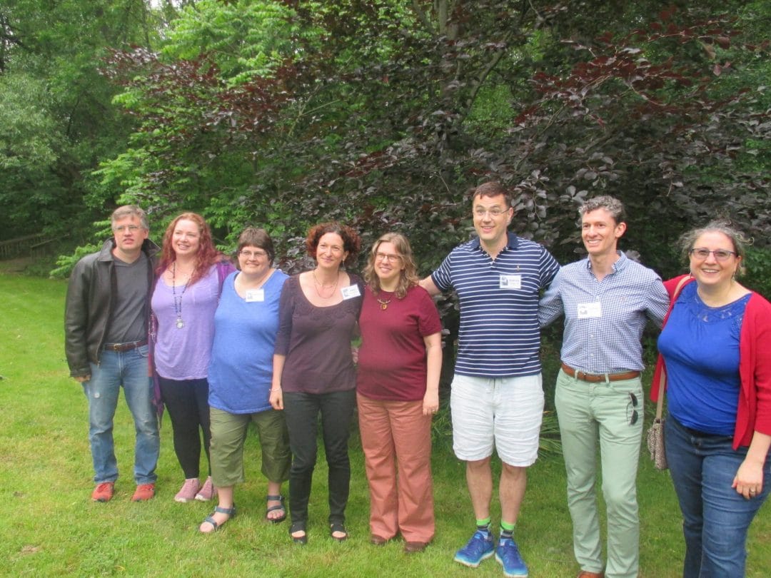 Members of the Class of 1989 in front of a tree planted in memory of their classmate Jimmy Hertz '89.